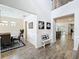 Inviting foyer featuring modern decor, and a glimpse into the adjacent dining and living areas at 2676 Estuary Loop, Oviedo, FL 32765
