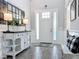 Bright foyer features modern decor, elegant lighting, and a welcoming atmosphere at 2676 Estuary Loop, Oviedo, FL 32765