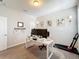 Bright home office space featuring a desk, workout equipment and carpet flooring at 2676 Estuary Loop, Oviedo, FL 32765