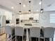 Kitchen with white cabinets, granite countertops, stainless appliances, and pendant lighting at 2676 Estuary Loop, Oviedo, FL 32765