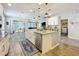Spacious kitchen island with granite countertops and pendant lighting at 2676 Estuary Loop, Oviedo, FL 32765