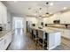 Bright kitchen with granite countertops, stainless appliances, and a spacious island at 2676 Estuary Loop, Oviedo, FL 32765