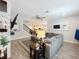 Open-concept living space with stone fireplace and TV at 2676 Estuary Loop, Oviedo, FL 32765