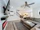 Open-concept living room with view of the kitchen, showcasing the home's flow and layout at 2676 Estuary Loop, Oviedo, FL 32765