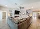 Spacious living room with stylish fireplace, TV, and staircase at 2676 Estuary Loop, Oviedo, FL 32765