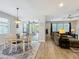 Bright dining area connected to a cozy living space with a screened patio at 2676 Estuary Loop, Oviedo, FL 32765