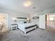 Spacious main bedroom featuring a bed and carpet flooring at 2676 Estuary Loop, Oviedo, FL 32765