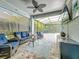 Enclosed patio featuring wicker furniture, a ceiling fan, and an outdoor television at 2676 Estuary Loop, Oviedo, FL 32765
