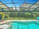 Relaxing pool with a screened-in lanai offering privacy and a clear view of the lush backyard at 2676 Estuary Loop, Oviedo, FL 32765