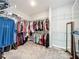 Spacious walk-in closet with ample shelving and hanging space for organization at 2676 Estuary Loop, Oviedo, FL 32765