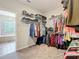 Spacious walk-in closet with ample shelving and hanging space for clothes at 2676 Estuary Loop, Oviedo, FL 32765
