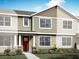 Inviting home exterior with varied textures, including lap siding, shingles, and stone accents, and a well-manicured lawn at 3025 Douglas Fir Dr, Apopka, FL 32703