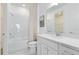 Bright bathroom featuring a white vanity, subway tile shower, and modern fixtures at 3118 Norcott Dr, Davenport, FL 33837