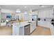 Well-lit kitchen with a large island, stainless steel appliances, and an open layout to the living room at 3118 Norcott Dr, Davenport, FL 33837