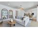 Bright open-concept living room flows into a modern kitchen with a large island at 3118 Norcott Dr, Davenport, FL 33837