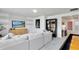 Inviting living room featuring a comfortable white sofa, modern cabinet and chic decor at 3118 Norcott Dr, Davenport, FL 33837