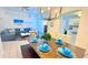 Open concept living and dining area with stylish furnishings and ample natural light at 3129 Arrow Dr, Kissimmee, FL 34746