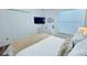 Bright main bedroom with white furniture, a built-in closet, and a comfortable bed at 3129 Arrow Dr, Kissimmee, FL 34746