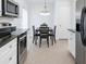 Well-appointed kitchen with stainless steel appliances, dark countertops, and a dining area with ample natural light at 3260 Pinto Dr, Kissimmee, FL 34746