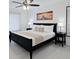 Serene main bedroom featuring a ceiling fan, neutral decor, and a comfortable bed with bedside tables and lamps at 3260 Pinto Dr, Kissimmee, FL 34746