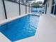 Sparkling blue in-ground pool with a white deck and comfortable outdoor furniture at 3260 Pinto Dr, Kissimmee, FL 34746
