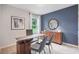 Modern office space with a bright window, neutral colors, and stylish decor at 3412 Wynwood Forest Dr, Ocoee, FL 34761