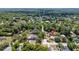 An aerial of the area shows a neighborhood with mature trees, quiet streets and established homes at 360 W University Ave, Orange City, FL 32763