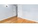 A comfortable bedroom features hardwood flooring and a light fixture at 360 W University Ave, Orange City, FL 32763