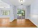 Dining area with hardwood floors and sliding glass doors to the backyard at 360 W University Ave, Orange City, FL 32763