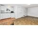 Features a compact kitchenette with white cabinets, ample storage, and neutral countertops at 360 W University Ave, Orange City, FL 32763