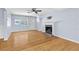 A welcoming living room with hardwood floors, a fireplace, and neutral paint colors at 360 W University Ave, Orange City, FL 32763