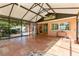 Spacious screened-in patio with tile flooring, offering a serene outdoor living space at 360 W University Ave, Orange City, FL 32763