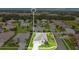 An aerial showcases a well-maintained home in a neighborhood with landscaping and easy street access at 4002 Richmond Xing, Leesburg, FL 34748
