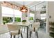Cozy breakfast nook with views of the backyard and a decorative chandelier at 4002 Richmond Xing, Leesburg, FL 34748