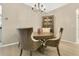 Elegant dining room featuring a chandelier, stylish furniture, and hardwood floors at 4002 Richmond Xing, Leesburg, FL 34748
