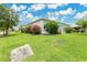Well-maintained home exterior with a green lawn and beautiful landscaping at 4002 Richmond Xing, Leesburg, FL 34748