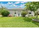 Charming home with a well-manicured lawn, colorful bushes, and a welcoming front entrance at 4002 Richmond Xing, Leesburg, FL 34748