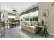 Cozy living room with sofa seating and large windows overlooking the yard at 4002 Richmond Xing, Leesburg, FL 34748