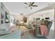 Open living area featuring views of the dining area, kitchen, and comfortable seating at 4002 Richmond Xing, Leesburg, FL 34748