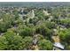 Overhead shot of wooded residential area showcases the community homes and tree-lined streets at 5 Pecan Drive Crse, Ocala, FL 34472
