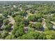 An aerial shot captures the residential area with its well-spaced homes and lush green landscape at 5 Pecan Drive Crse, Ocala, FL 34472