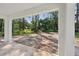 Outdoor patio with views of the wooded backyard and lush greenery, perfect for relaxing at 5 Pecan Drive Crse, Ocala, FL 34472