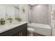 Modern bathroom featuring a shower/tub combo and a granite-top vanity at 5 Pecan Drive Crse, Ocala, FL 34472