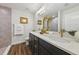 Bright bathroom features a dual vanity with dark cabinets and a frameless shower with floor-to-ceiling tile at 5 Pecan Drive Crse, Ocala, FL 34472