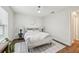 Bright bedroom with a modern ceiling fan, a comfy queen bed, and a large window at 5 Pecan Drive Crse, Ocala, FL 34472