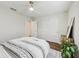 Bright bedroom featuring a modern ceiling fan and a mirrored closet at 5 Pecan Drive Crse, Ocala, FL 34472