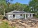 Modern exterior features clean lines, bright white facade, and the home is located on a large lot at 5 Pecan Drive Crse, Ocala, FL 34472