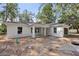 Newly built white home with charming architecture, bright windows, and a covered front porch at 5 Pecan Drive Crse, Ocala, FL 34472