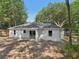 The home features a bright and spacious backyard surrounded by mature trees in a quiet neighborhood at 5 Pecan Drive Crse, Ocala, FL 34472