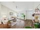 Open-concept living room with vaulted ceiling, hardwood floors, and an abundance of light at 5 Pecan Drive Crse, Ocala, FL 34472